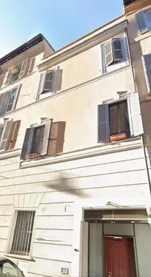 a bedroom with a large bed and two lamps at GDR Apartment - City Center in Rome