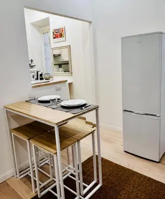 a bedroom with a bed with a black and white comforter at GDR Apartment - City Center in Rome