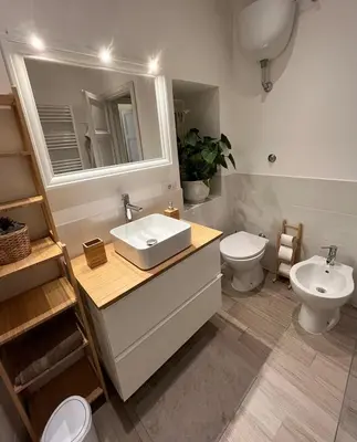 a bathroom with a sink and a mirror at GDR Apartment - City Center in Rome