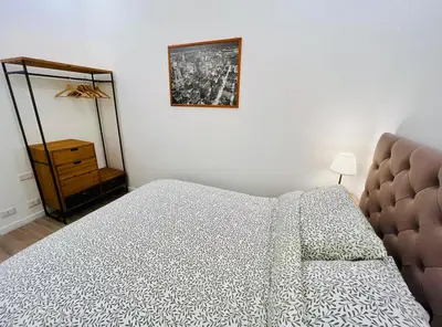 a bathroom with a sink and a toilet and a mirror at GDR Apartment - City Center in Rome
