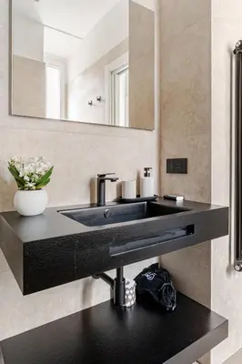 a bathroom with a black sink and a mirror at Home Sweet Rome Lucina in Rome