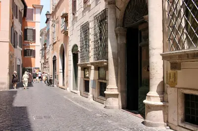 a city street with people walking down a street at Home Sweet Rome Lucina in Rome