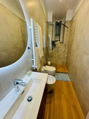 a bathroom with a sink and a toilet and a shower at Friendly Apartment San Saba in Rome