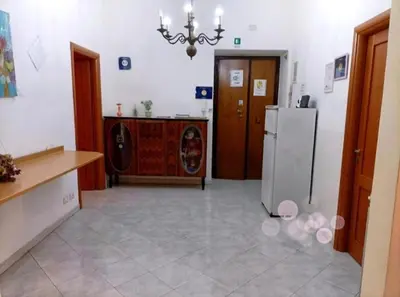 a kitchen with a refrigerator and a washing machine at APARTAMENTo FANTI22 in Rome