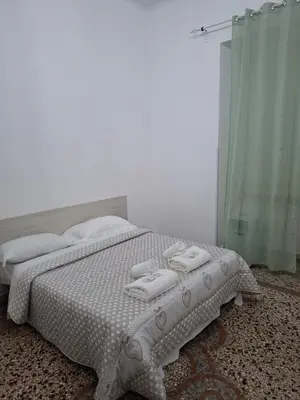 a bedroom with a bed with two towels on it at APARTAMENTo FANTI22 in Rome