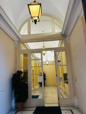 an entrance to a building with a large glass door at TritHome in Rome