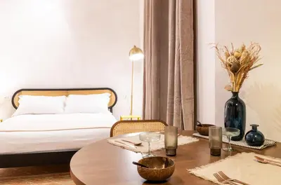 a bedroom with a bed and a table with a coffee table at Cunabu Morosini in Rome