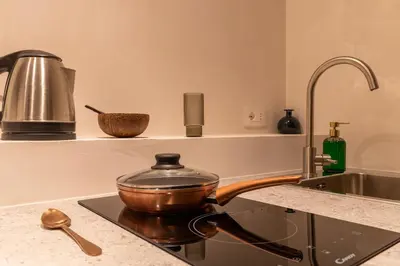 a pot sitting on top of a stove in a kitchen at Cunabu Morosini in Rome