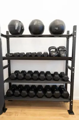 a shelf full of dumbbells and helmets at Residenza Labicana Luxury Apartment- Free Parking in Rome