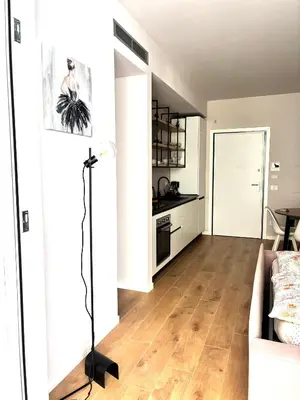 a living room with a couch and a table at Residenza Labicana Luxury Apartment- Free Parking in Rome