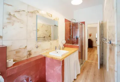 a bedroom with a red and white bed and a painting at Simi Roma - Carpegna in Rome