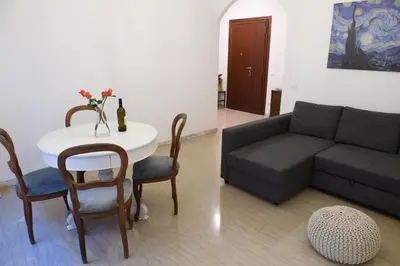 a living room with a couch and a table at Cesare a Trastevere in Rome