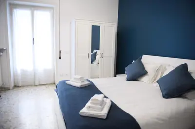 a bedroom with a bed with two folded towels on it at Cesare a Trastevere in Rome