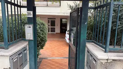 an entrance to a house with a gate at La Casetta tiny house in Rome in Rome