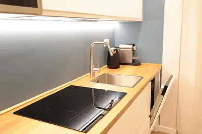a kitchen with a sink and a counter top at Gioia di Roma in Rome