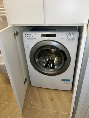 a washer and dryer in a small kitchen at Gioia di Roma in Rome