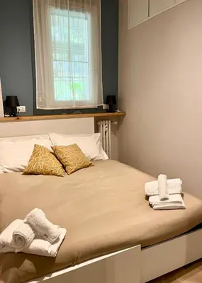 a bedroom with a bed with towels on it at Gioia di Roma in Rome