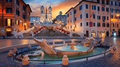a city square with a fountain in the middle at Awesome in Rome