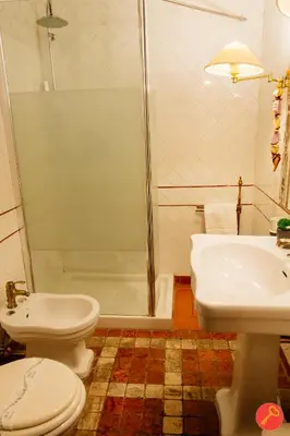 a bathroom with a shower and a toilet and a sink at Gorgeous House Trastevere in Rome