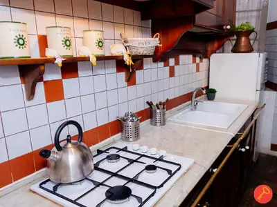 a tea kettle on a stove top in a kitchen at Gorgeous House Trastevere in Rome