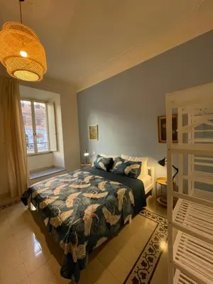 a bedroom with a bed and a window at Enjoy Colosseo in Rome