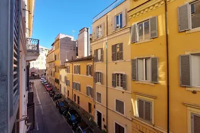 a view of a city street with yellow buildings at Capocci by Halldis in Rome