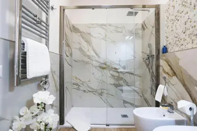 a bathroom with a shower and a sink at Lady A in Rome- Luxury Apartment in Rome