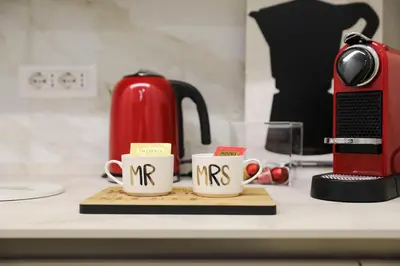 two coffee mugs with the word mrs written on them at Lady A in Rome- Luxury Apartment in Rome