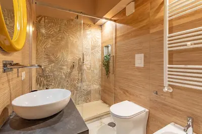 a bathroom with a sink and a toilet and a shower at OldStation in Rome