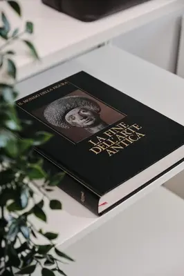 a book sitting on top of a table at Colosseo-San Giovanni, New Apartment Wi-Fi & A-C in Rome