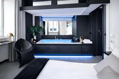 a bedroom with a tub with a bed and a mirror at LUX- Spanish Steps 60A Exclusive Suite Apartment in Rome