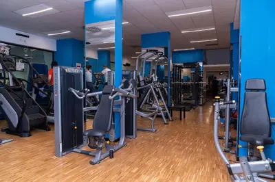 a gym with many treadmills and cardio machines at Joy Home in Rome