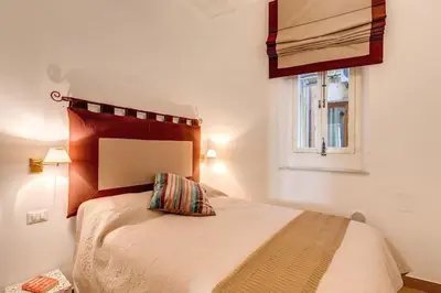 a bedroom with a bed and a window at NEW Navona Bright Apartment in Rome
