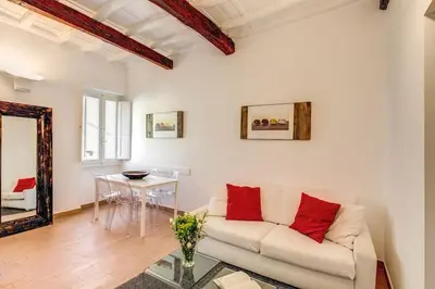 a living room with a couch and a table at NEW Navona Bright Apartment in Rome