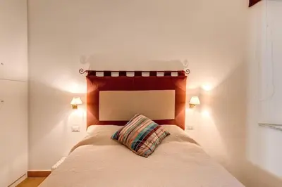 a bedroom with a bed with a pillow on it at NEW Navona Bright Apartment in Rome