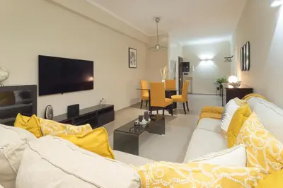a living room with a couch and a tv at Anastasia Comfort at the Vatican with Balcony in Rome