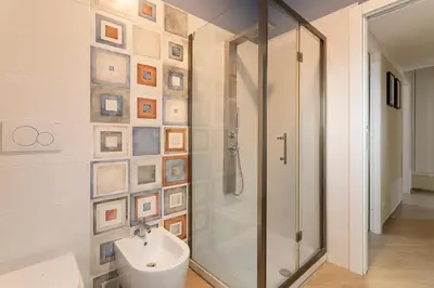 a bathroom with a shower and a sink and a toilet at Anastasia Comfort at the Vatican with Balcony in Rome