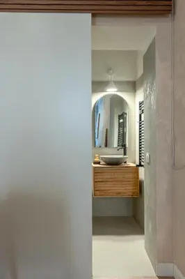 a bathroom with a sink and a mirror at Eos Retreat in Trastevere with pool in Rome