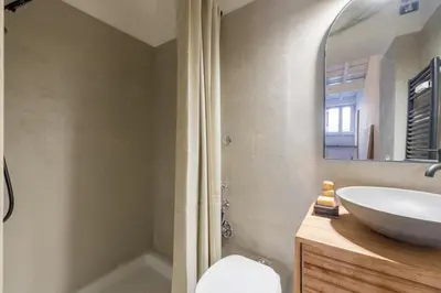 a bathroom with a shower with a shower curtain at Eos Retreat in Trastevere with pool in Rome