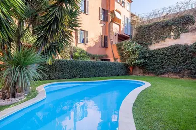a green vase sitting on a table with a cactus at Eos Retreat in Trastevere with pool in Rome