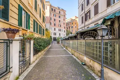 an empty street in a city with buildings at Cozy apartment in Trastevere with patio - AC in Rome