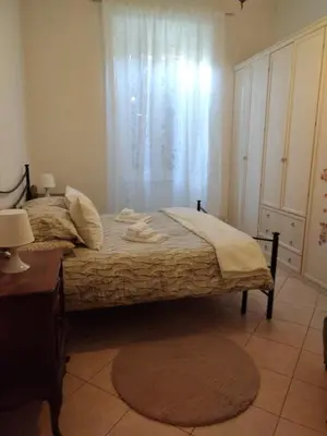 a bedroom with a bed with towels on it at Camilla's House in Rome