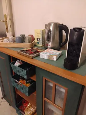 a counter with a tea kettle on top of it at Camilla's House in Rome