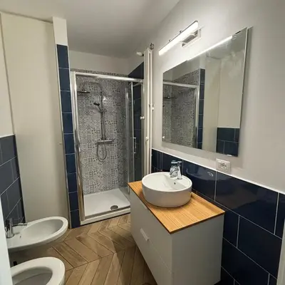 a bathroom with a sink and a shower and a toilet at Casa Mari - Cozy Apartment San Paolo Rome in Rome
