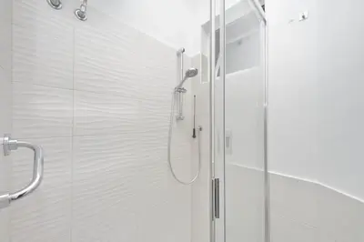 a shower with a glass door in a bathroom at CasAchille Mini Studio in Rome