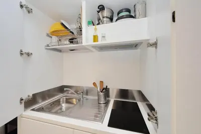 a small kitchen with a sink and a counter at CasAchille Mini Studio in Rome