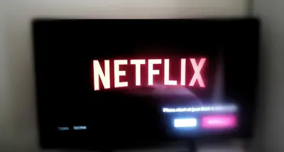 a television with a netflix sign on it at Gianicolense Holiday Suite-Apartment in Rome