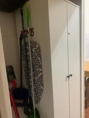 a room with two ski poles hanging on a wall at Apartment in historic palace in Rome