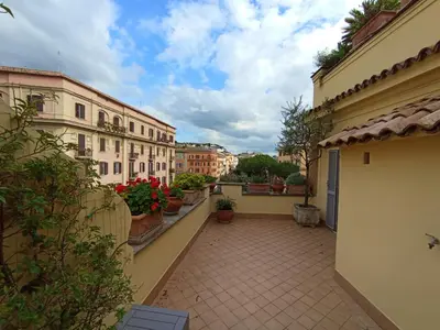 a balcony of a building with plants and flowers at Vatican Penthouse - Terrace with view in Rome