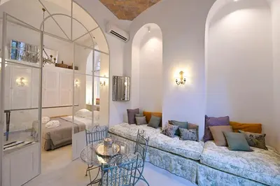 a living room with a couch and a table at Romantic Silent Garden in Rome
